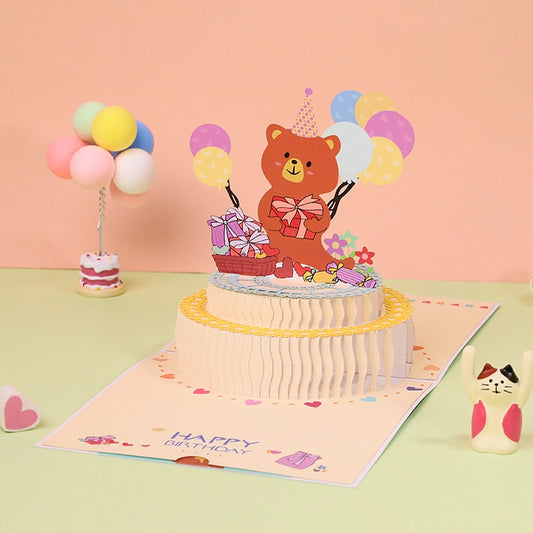 Cute 3D birthday pop-up card featuring a bear, birthday cake, balloons and gifts