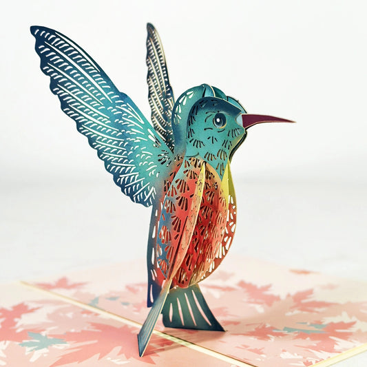 Close-up of colorful 3D pop-up hummingbird greeting card with detailed bird design