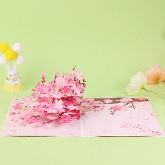 Open 3D cherry blossom greeting card with blooming pink flowers