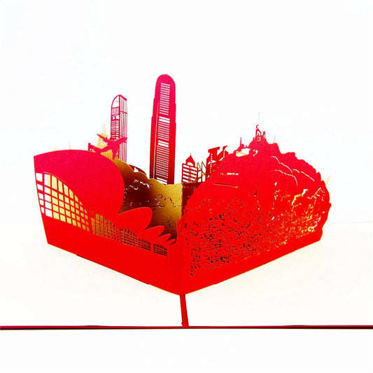 Side view of Hong Kong cityscape pop-up card showing IFC tower and Victoria Peak silhouette in vibrant red paper art