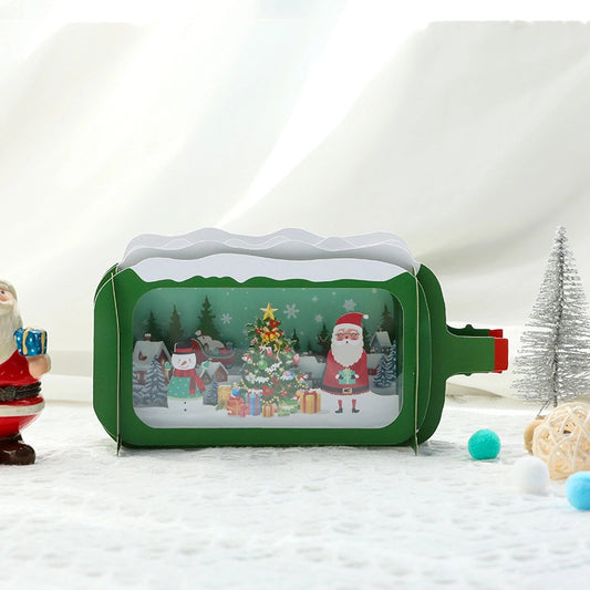 Isolated front view of the green retro TV Christmas card with a festive scene of Santa and gifts behind a transparent window.