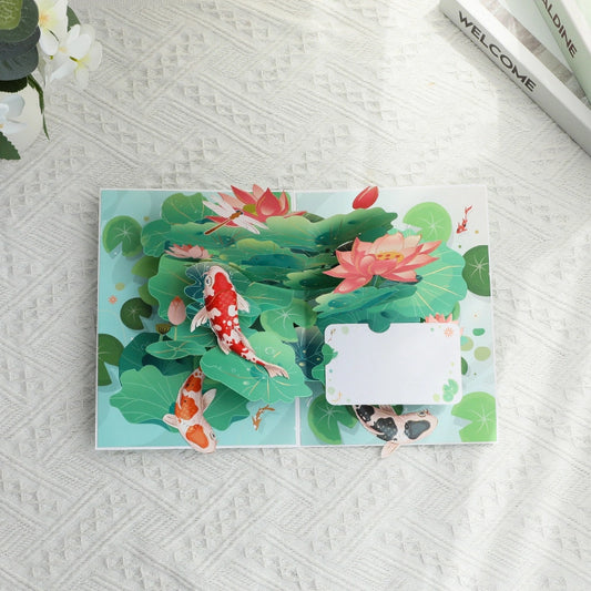 Lotus and koi fish 3D pop-up card viewed from above showing layered paper artwork