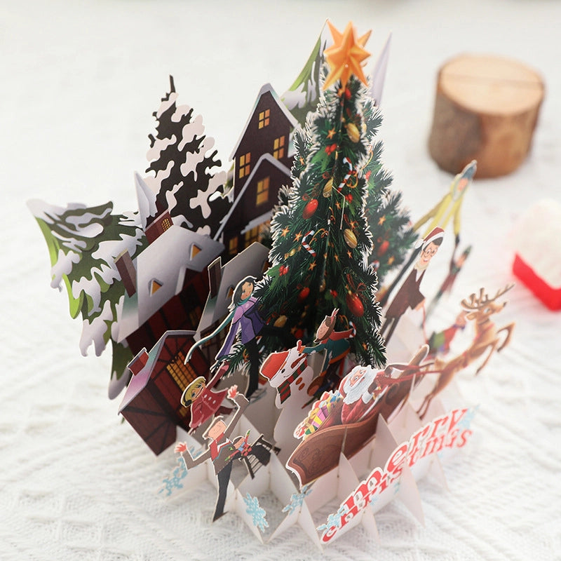 Christmas pop-up card viewed from the back showing layered winter scene