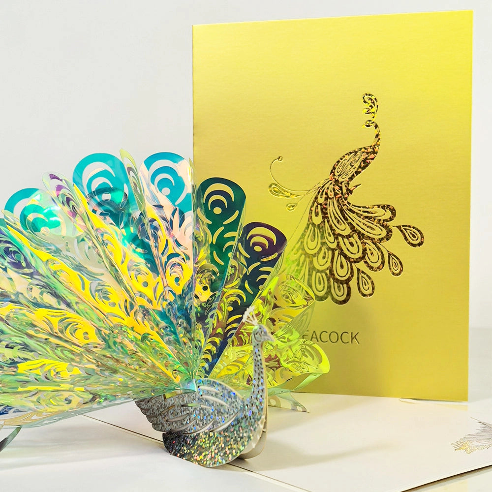 Colorful 3D peacock pop-up card opened with layered feathers