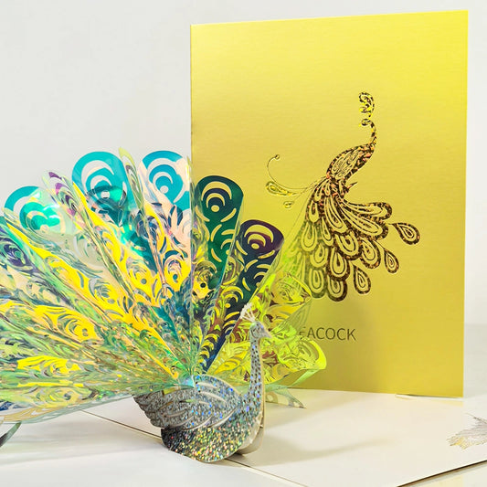 Colorful 3D peacock pop-up card opened with layered feathers