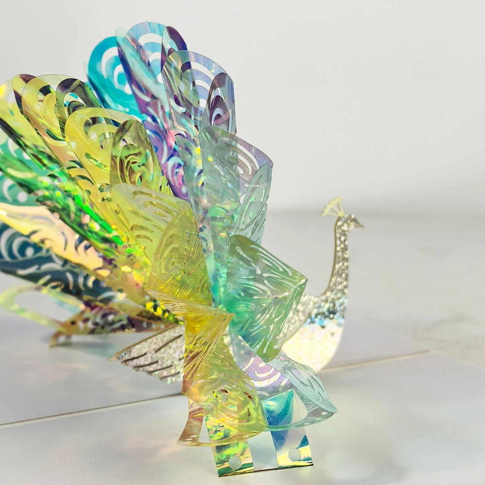 Close-up of colorful peacock 3D pop-up greeting card