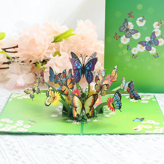 Open butterfly pop-up greeting card with colorful butterflies, flowers and green garden design