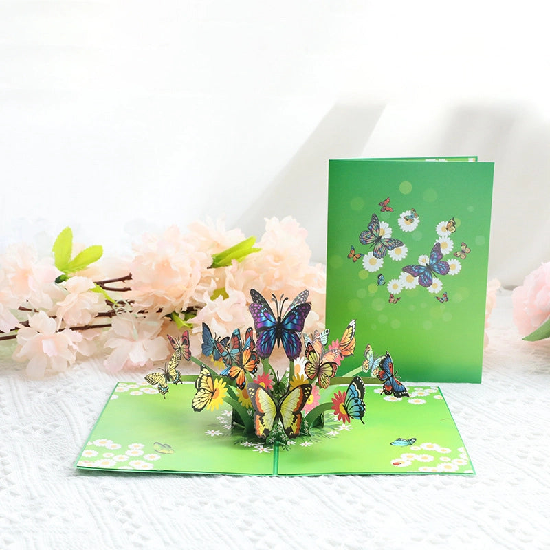 3D butterfly greeting card displayed open with colorful garden pop-up design