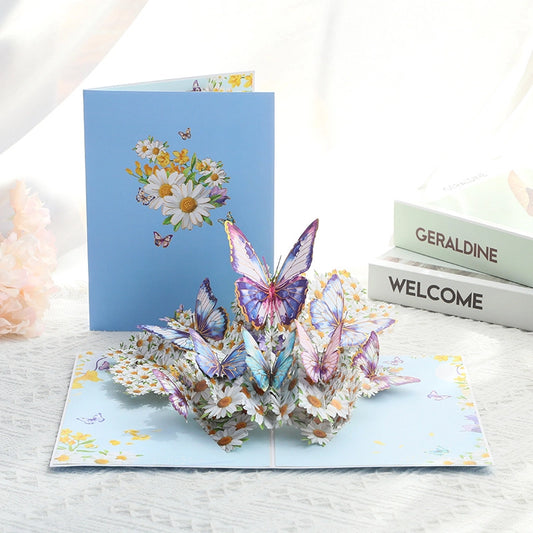 Open 3D birthday card showing a large pop-up arrangement of pink peonies and multicolored butterflies