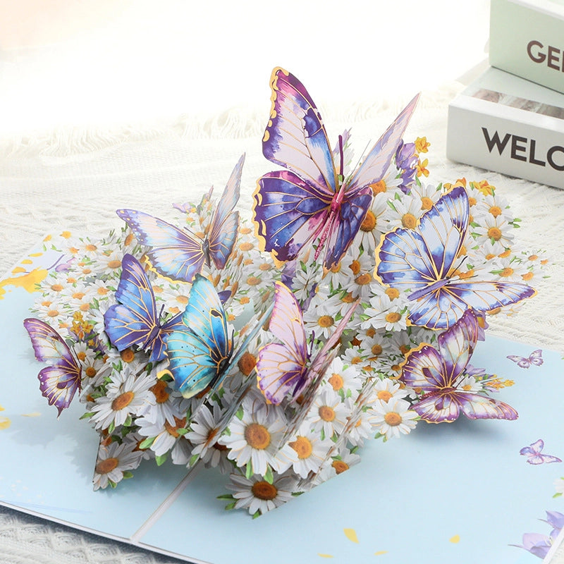 Side angle detail of the intricate paper cutting layers of the butterfly garden pop-up card