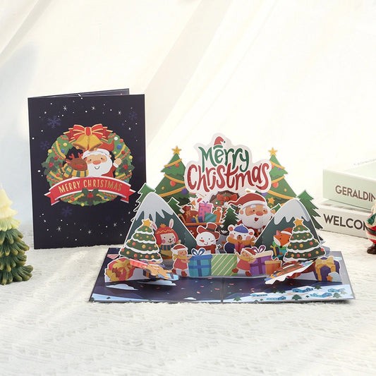 3D pop-up Christmas card featuring Santa Claus, Christmas trees, gifts and Merry Christmas design