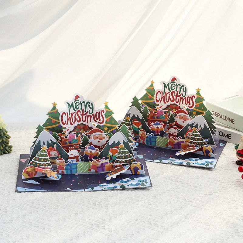 Open 3D Christmas pop-up card with Santa Claus, Christmas trees and festive winter scene