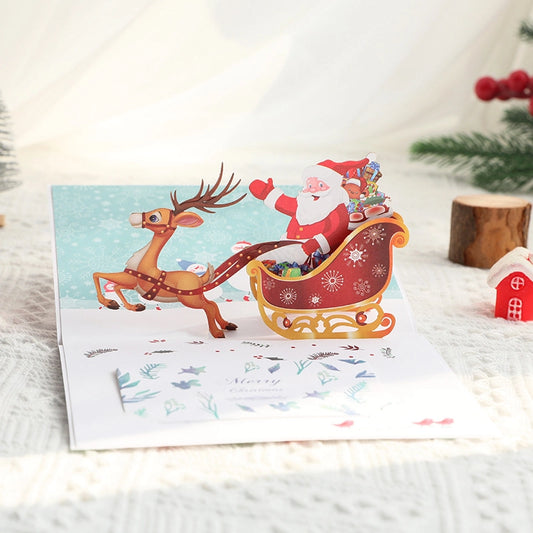 Open 3D Christmas card with Santa riding a reindeer sleigh