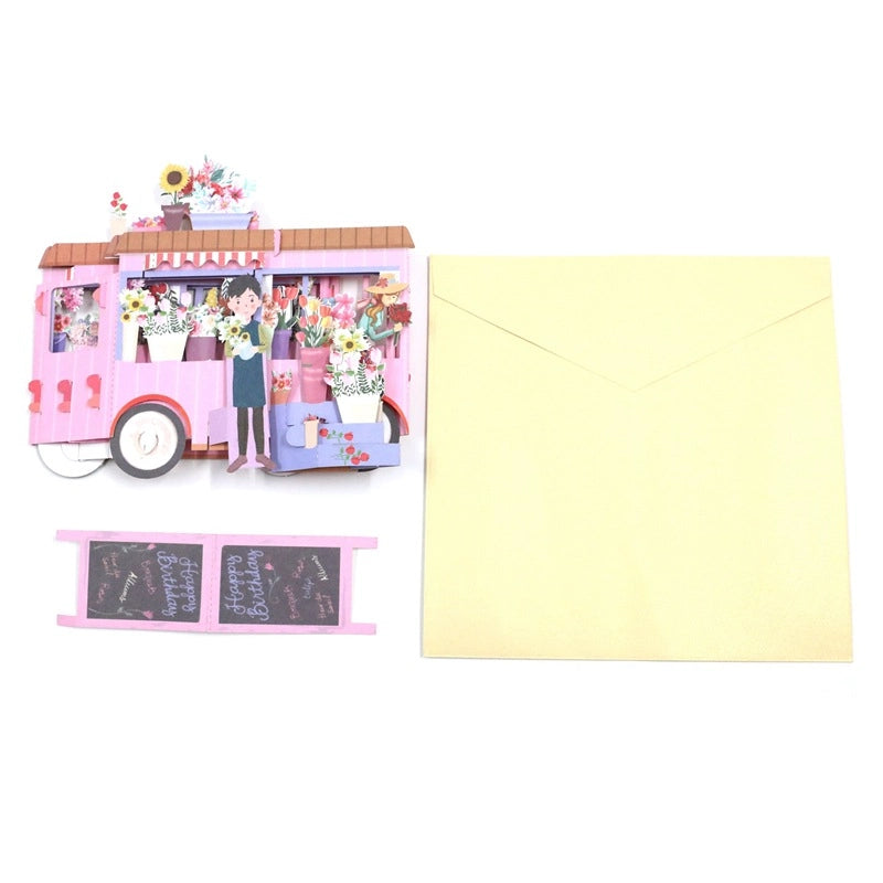 Open 3D pop-up birthday card featuring a colorful flower cart