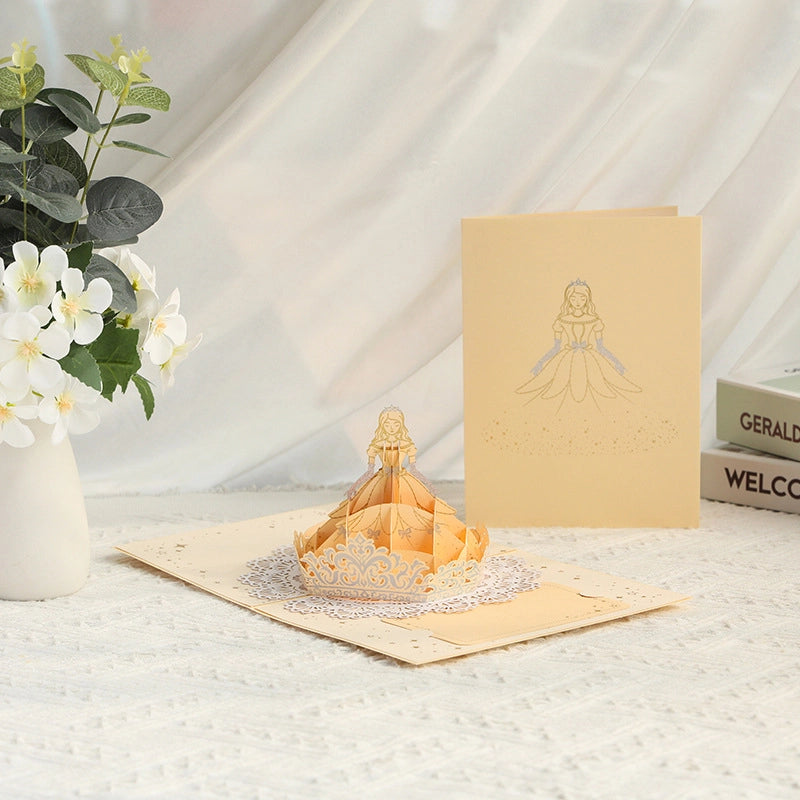 3D pop-up princess greeting card featuring an elegant golden princess dress and delicate decorative details