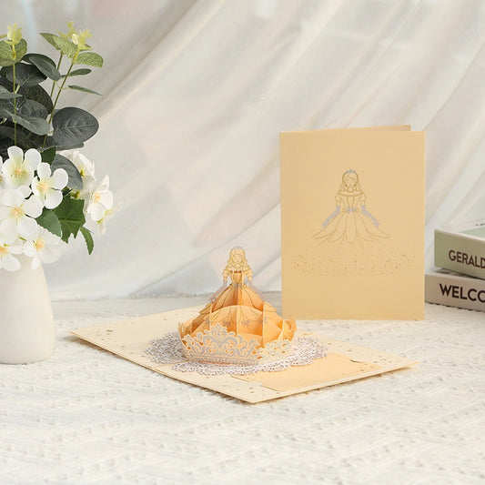 3D pop-up princess greeting card featuring an elegant golden princess dress and delicate decorative details