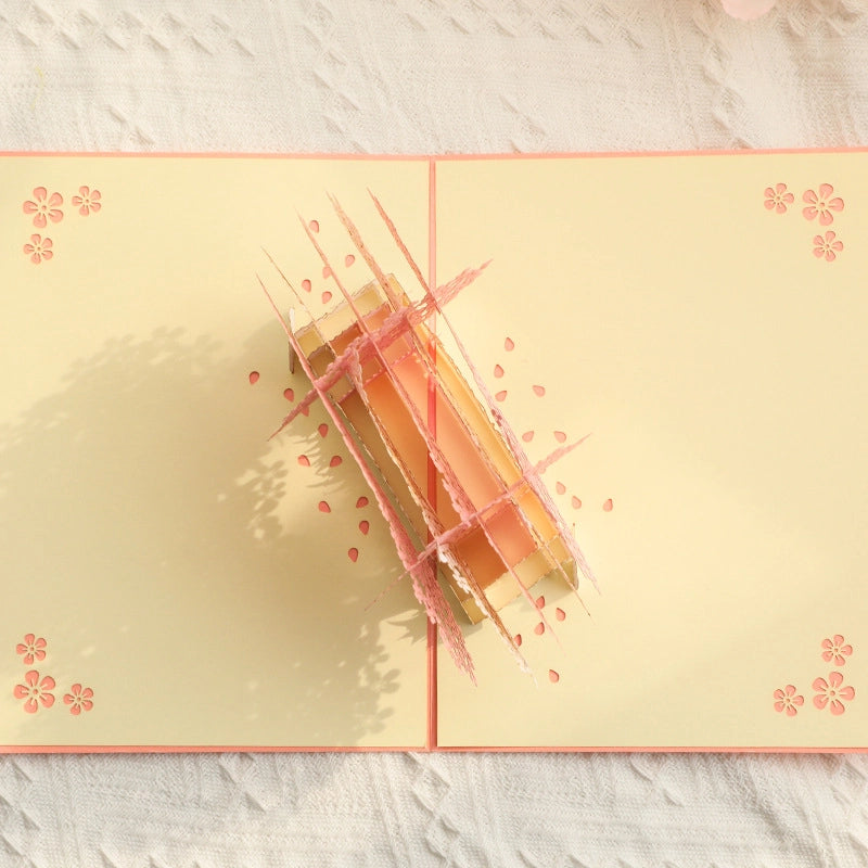 Top view of 3D pop-up cherry blossom greeting card