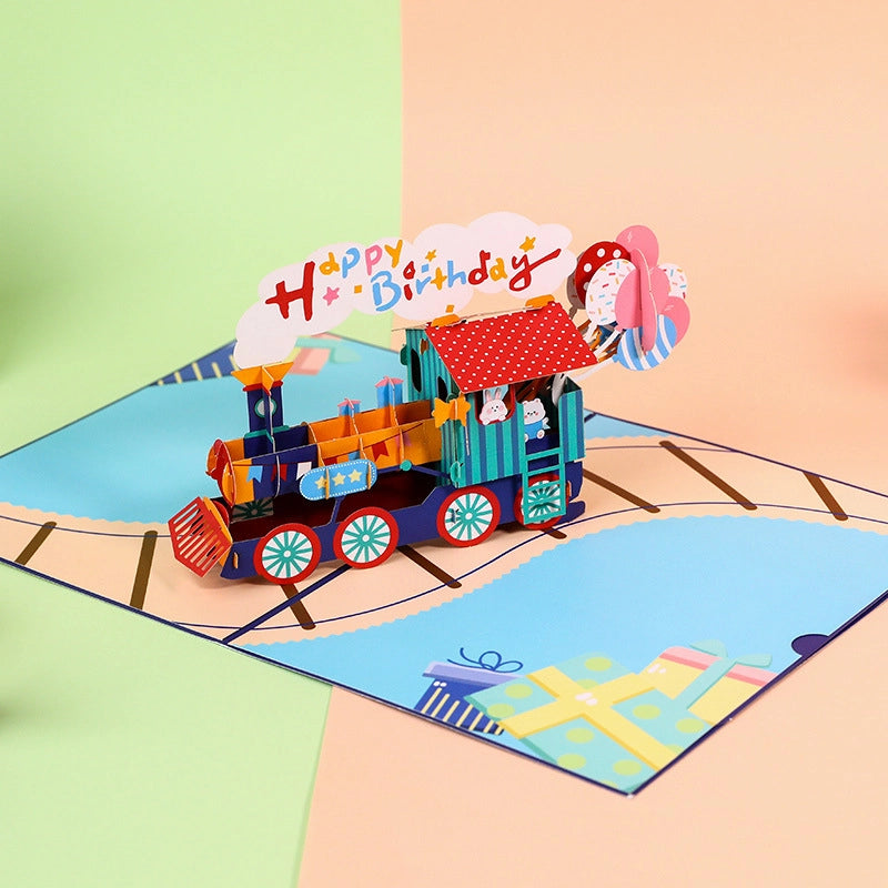 Side angle view of the 3D train pop-up card showing the depth of the locomotive and paper engineering details
