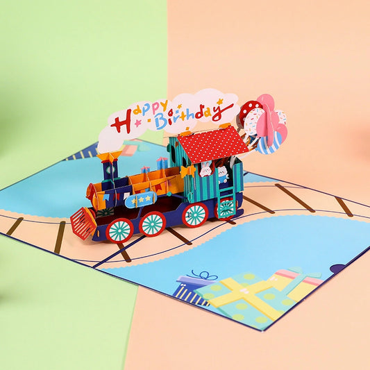 Side angle view of the 3D train pop-up card showing the depth of the locomotive and paper engineering details