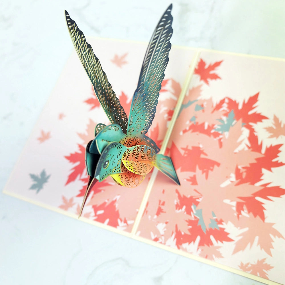 3D pop-up hummingbird greeting card opened with colorful layered bird design