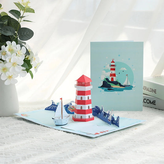 3D pop-up lighthouse card with sailboat and ocean waves