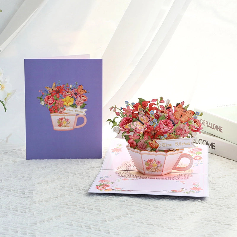 Purple cover greeting card opening to reveal pink teacup flower bouquet pop-up