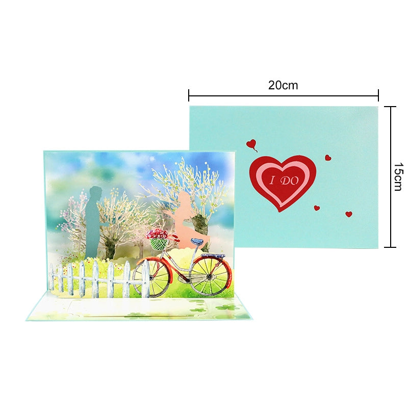 Dimensions of the romantic pop-up card showing 20cm width and 15cm height with bicycle and heart design.