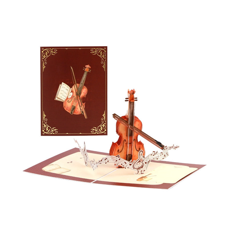 3D pop-up violin card displayed open with violin, bow, and flowing music notes