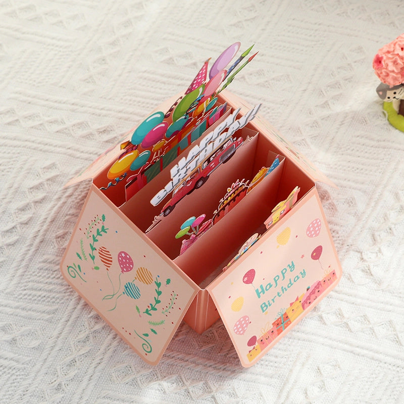 Open 3D pop-up birthday card showing layered party scene