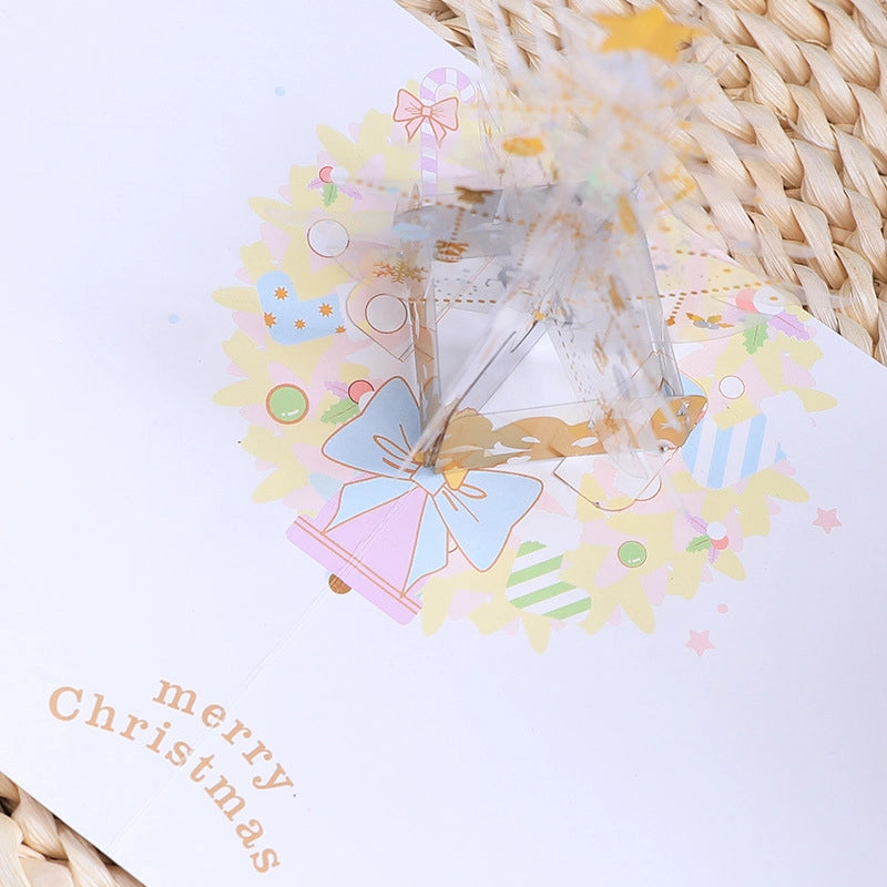 Close-up of 3D Christmas tree pop-up card with festive ornaments and decorations
