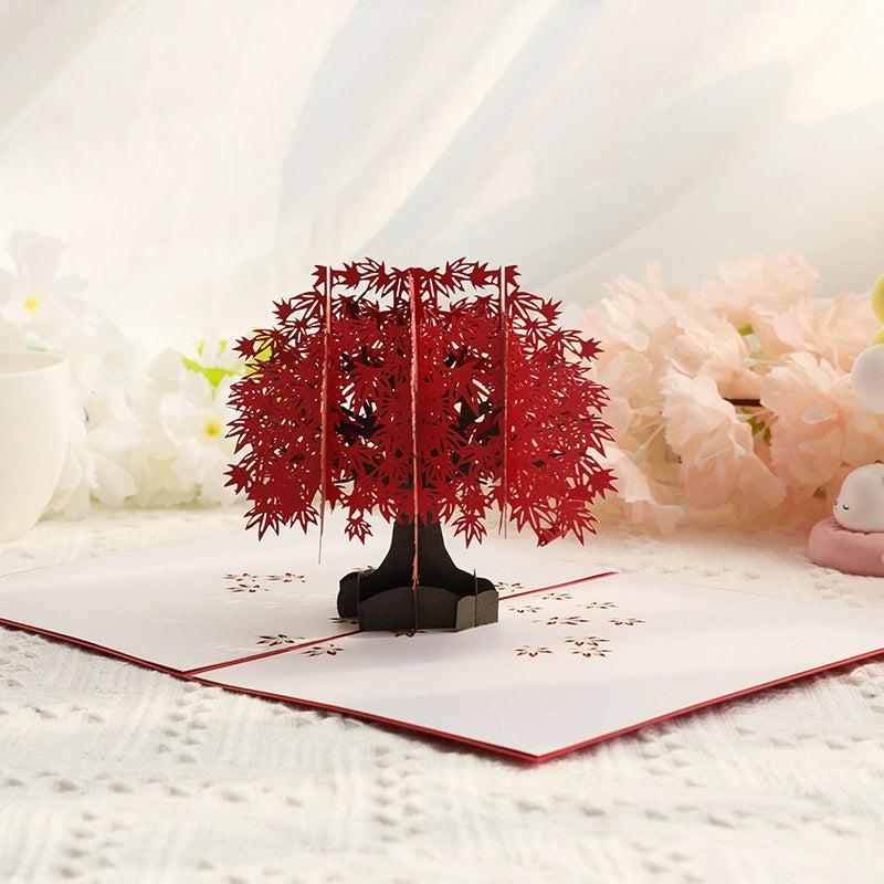 Three dimensional red tree pop up greeting card opened