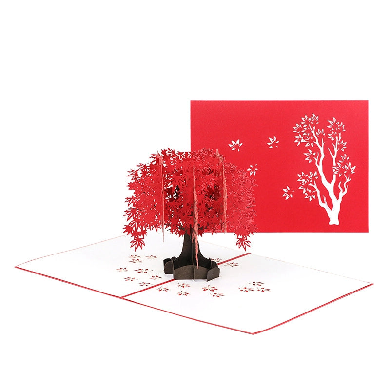 Red 3D tree pop up card showing detailed paper cut design