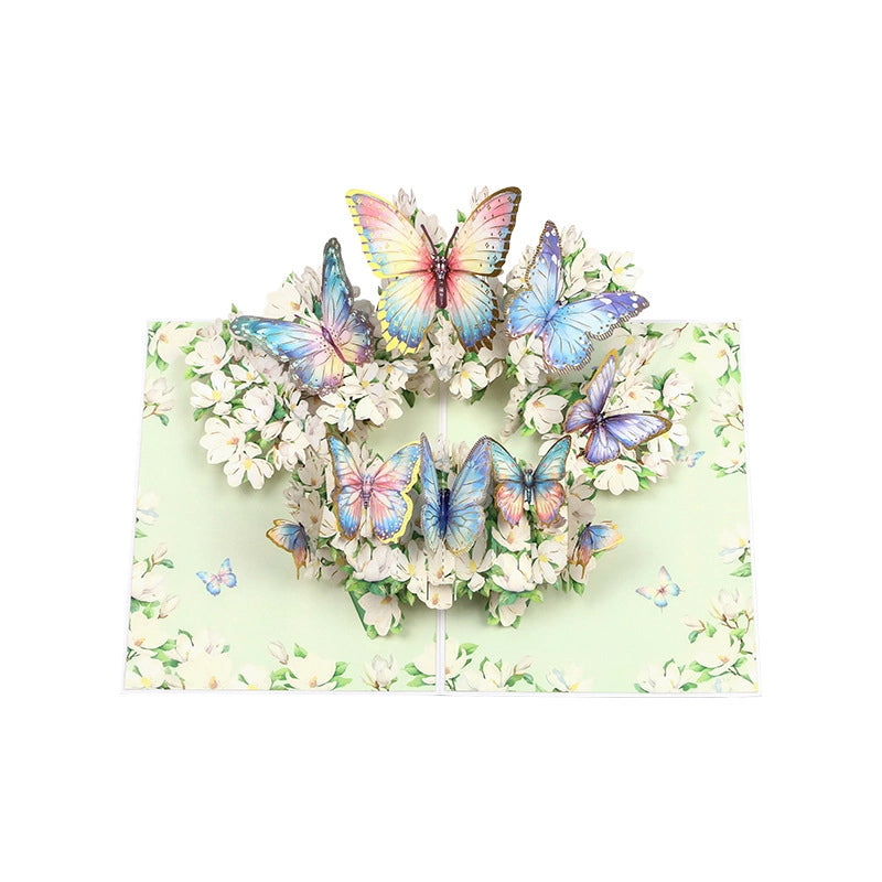 Open butterfly and flower 3D card displayed on a table as a unique birthday or graduation gift idea
