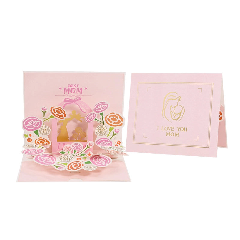 Front and back cover of the greeting card, showing gold foil "I Love You Mom" text and mother holding baby illustration on pink background
