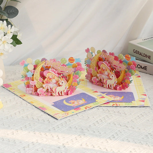 Open 3D unicorn birthday card featuring a colorful birthday scene with balloons, flowers and unicorn