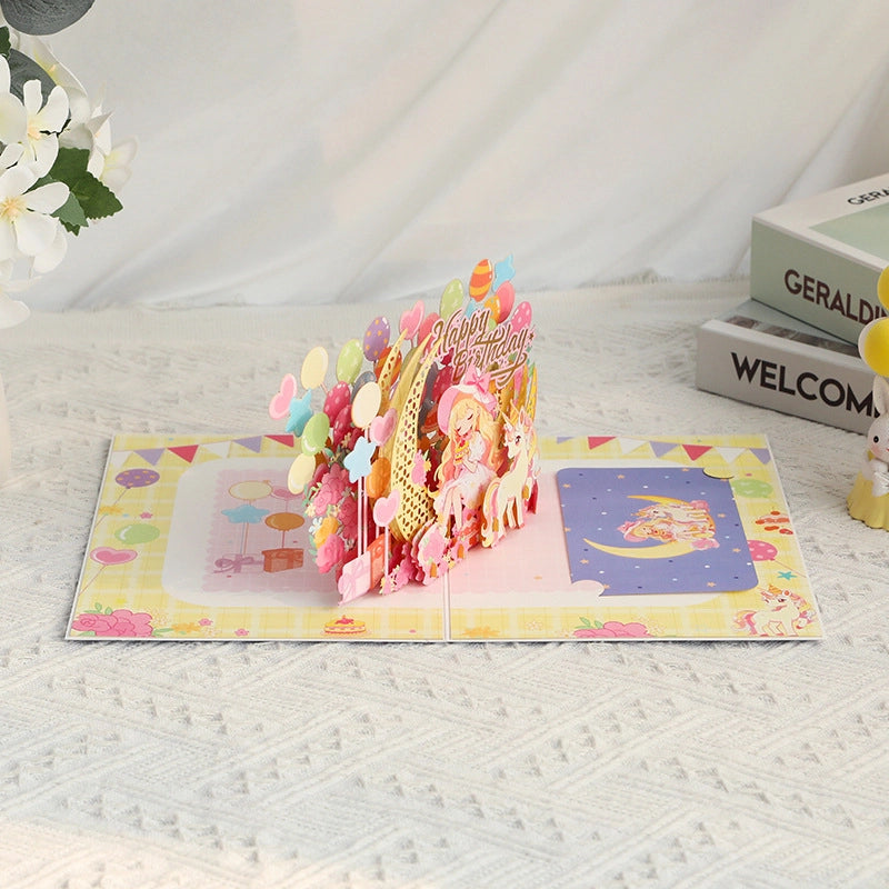 Magical unicorn 3D pop-up birthday card with layered paper design and colorful birthday decorations