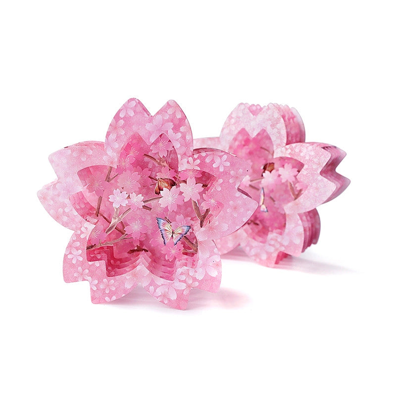Two pink cherry blossom 3D pop-up cards standing side by side showing intricate layered paper flower design with butterfly details
