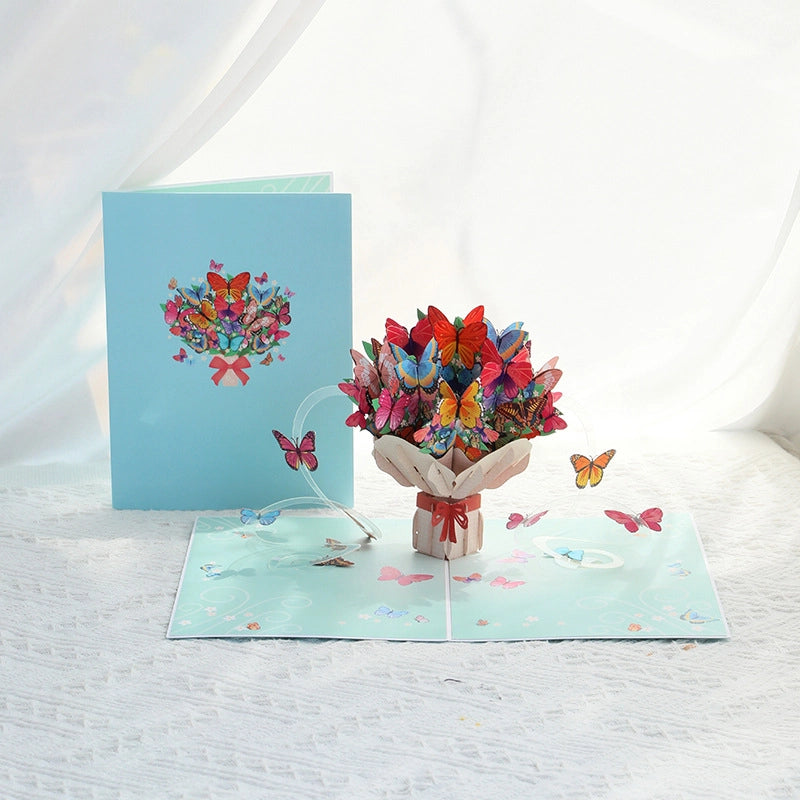  Colorful butterfly bouquet 3D pop-up card open on white background showing vibrant paper butterflies.
