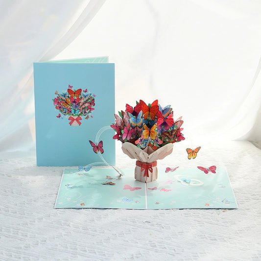  Colorful butterfly bouquet 3D pop-up card open on white background showing vibrant paper butterflies.
