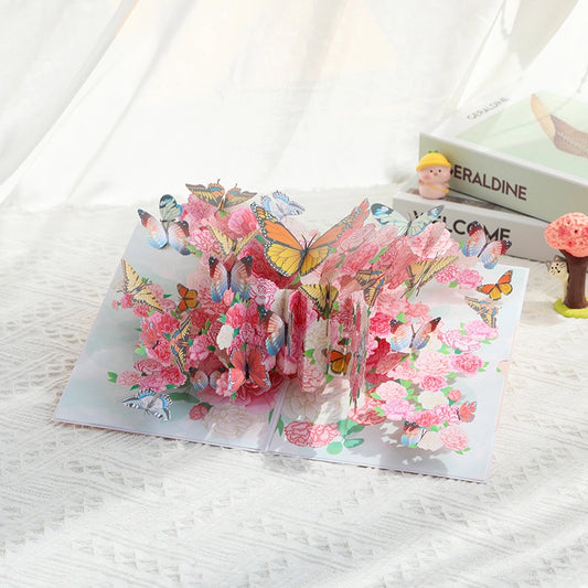 Open 3D pop-up card revealing a complex arrangement of pink peonies and multicolored butterflies standing upright.