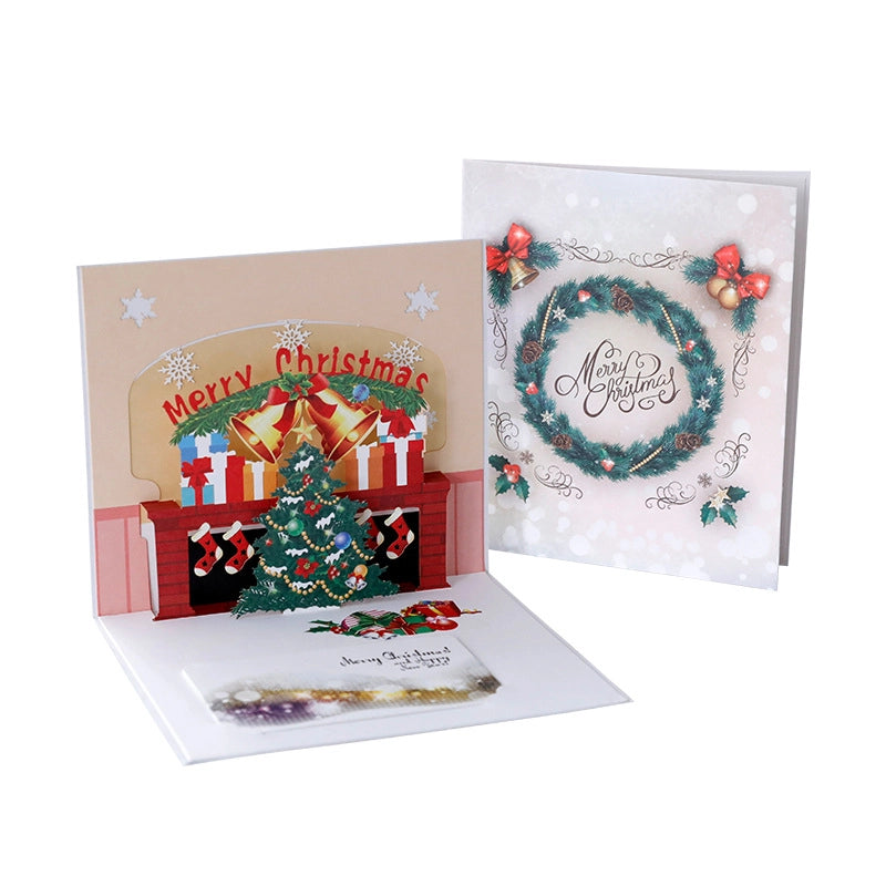Christmas pop-up card with festive fireplace Christmas tree and presents