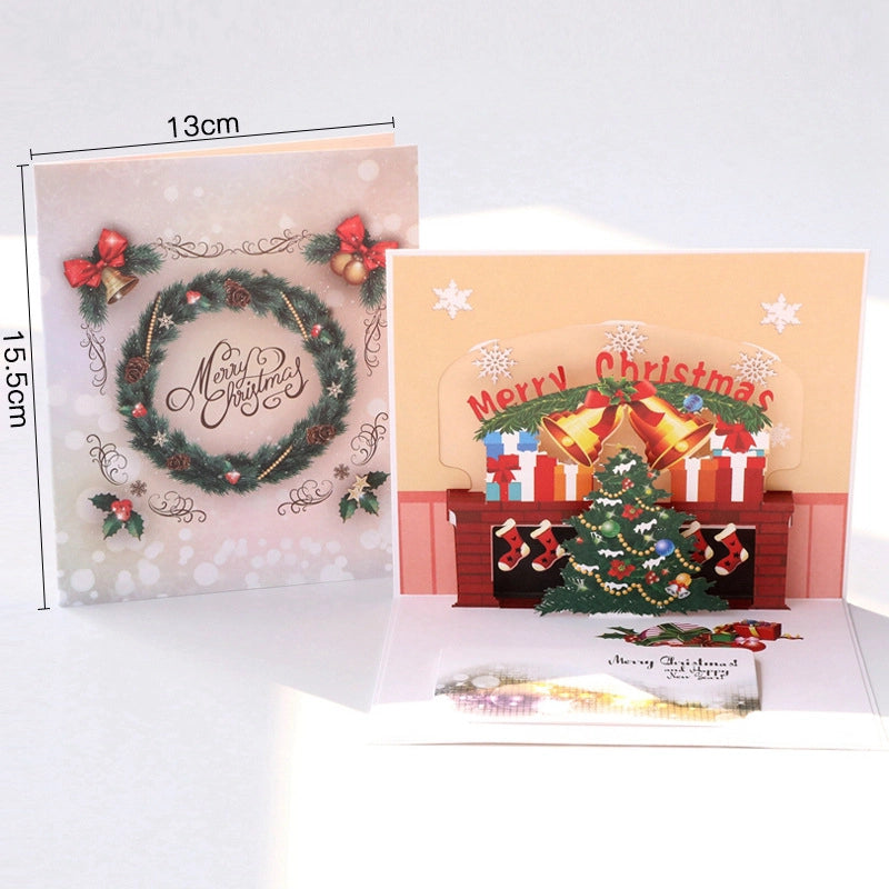 3D Christmas greeting card displayed open with pop-up holiday scene