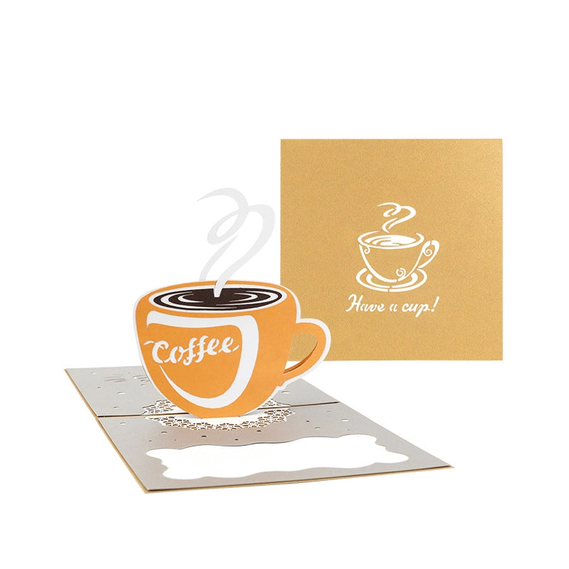 Kraft paper cover of a greeting card with silver foil stamping of a coffee cup and text "Have a cup!".
