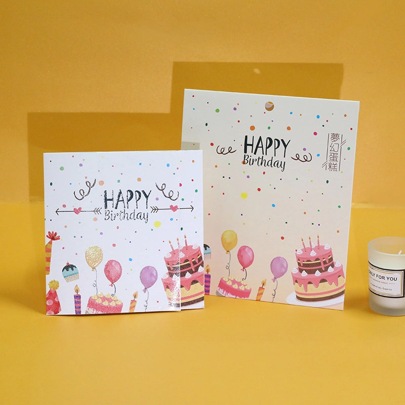 Front and back cover view of the Happy Birthday card featuring festive illustrations of cakes, balloons, and confetti.
