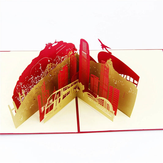 Hong Kong skyline 3D pop-up card featuring red and gold paper cut architecture, double-decker bus, and airplane, souvenir greeting card
