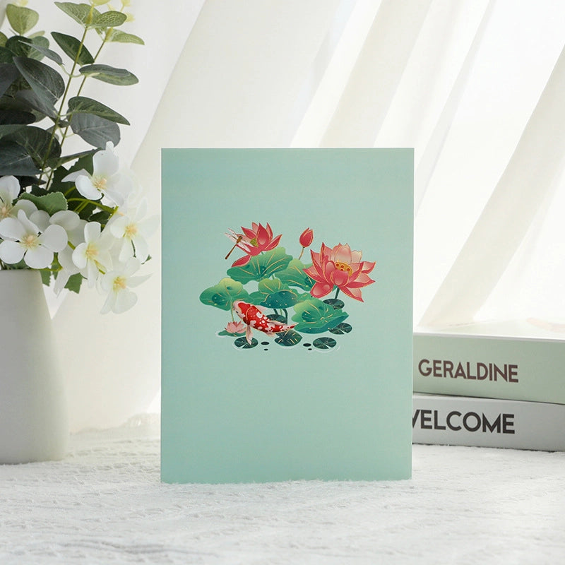 Elegant lotus and koi fish greeting card folded closed with floral pond artwork
