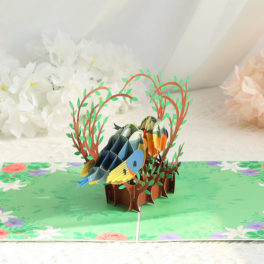Side profile view of 3D bird pop-up card showing depth and layering of paper art