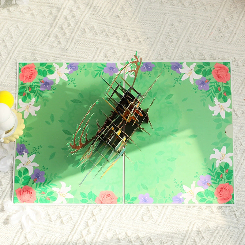 Back view of the pop-up mechanism showing the structural support and floral patterned background