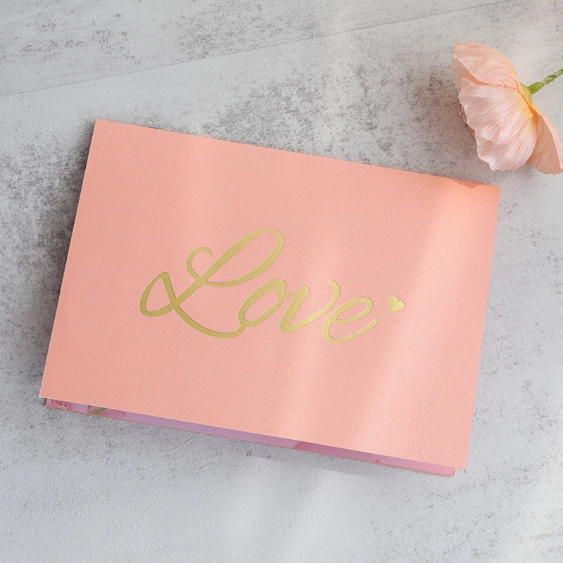 Closed pink Love greeting card with gold Love lettering