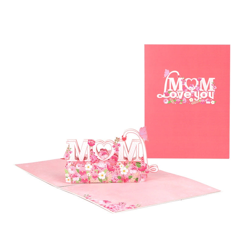Red Mom Love You card cover next to open 3D pink flower pop-up design on white background
